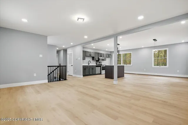 a kitchen with a sink cabinets and window