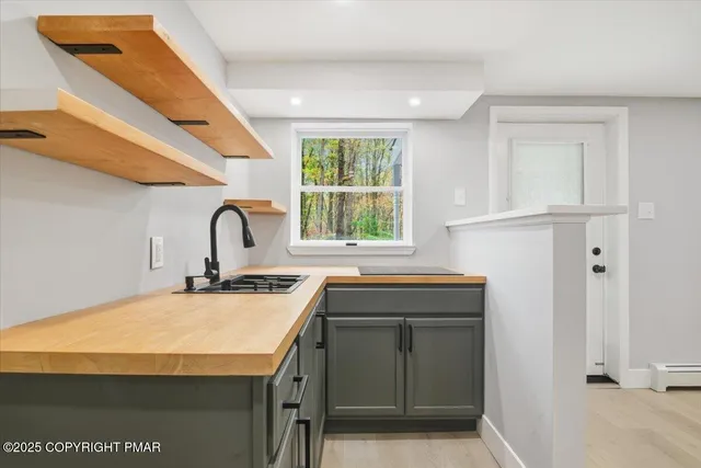 a bathroom with a toilet a sink and a mirror