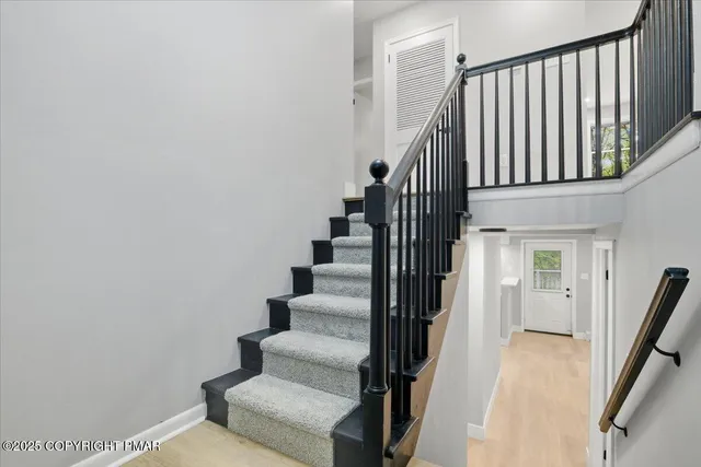 a view of kitchen with sink cabinet and refrigerator