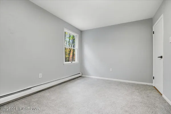 a view of a house with wooden floor and iron stairs