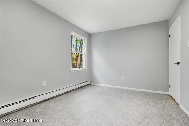 a view of a house with wooden floor and iron stairs