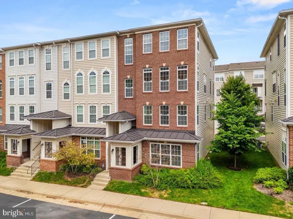 a front view of a building with garden