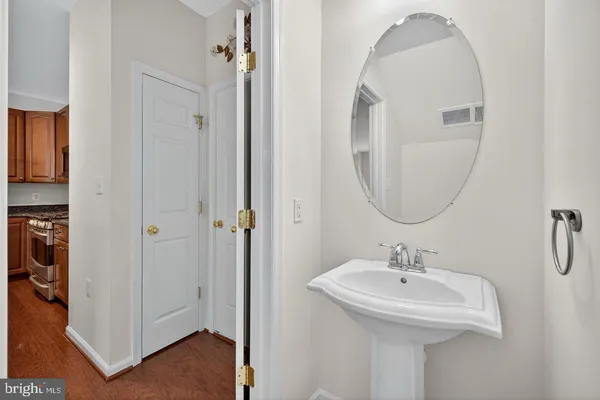 a bathroom with a sink a mirror and a shower