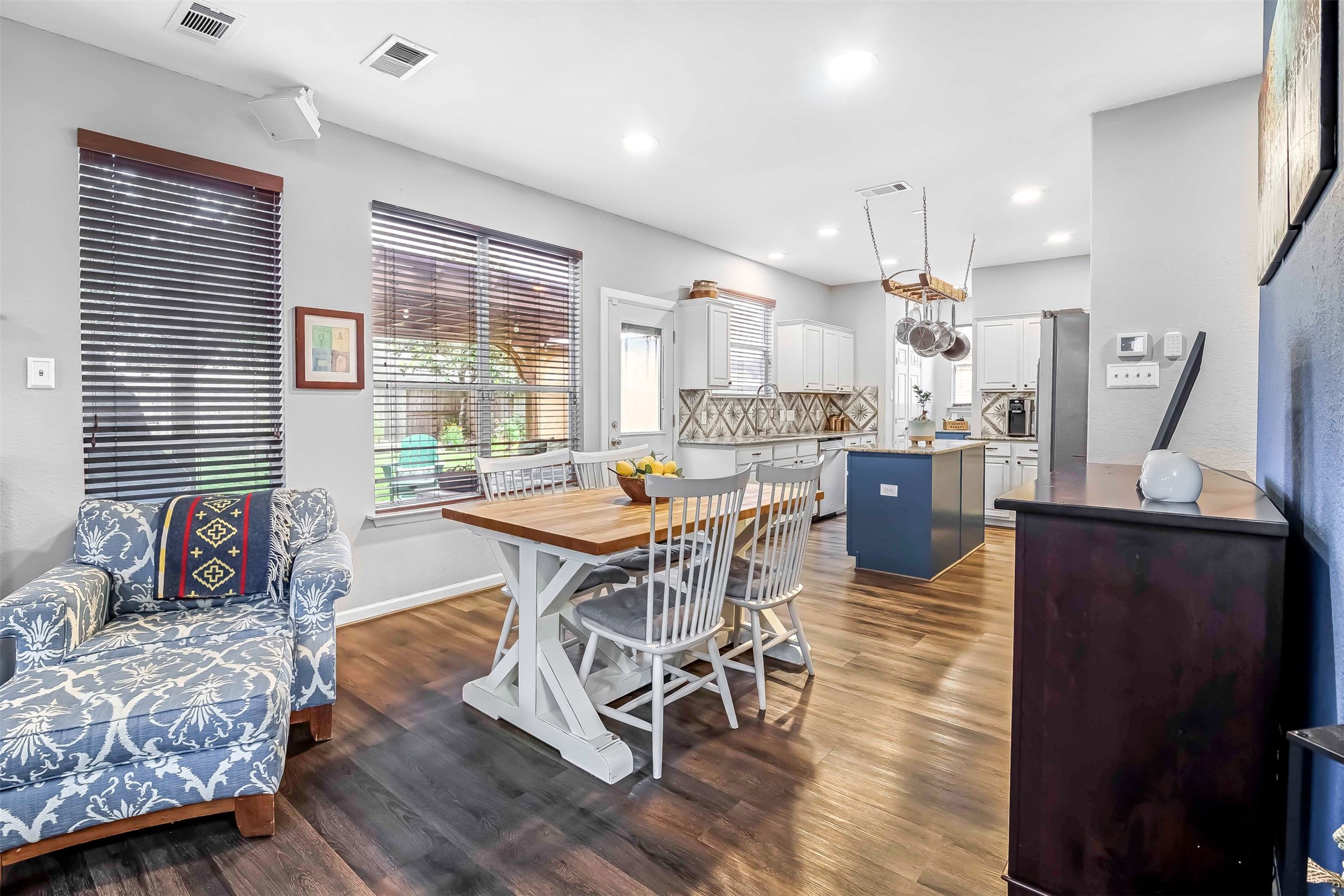 19303 Young Oak Street Spring, TX 77379 - Photo 13 of 29 Wall of large picture windows overlooking the backyard makes the space open and bright.