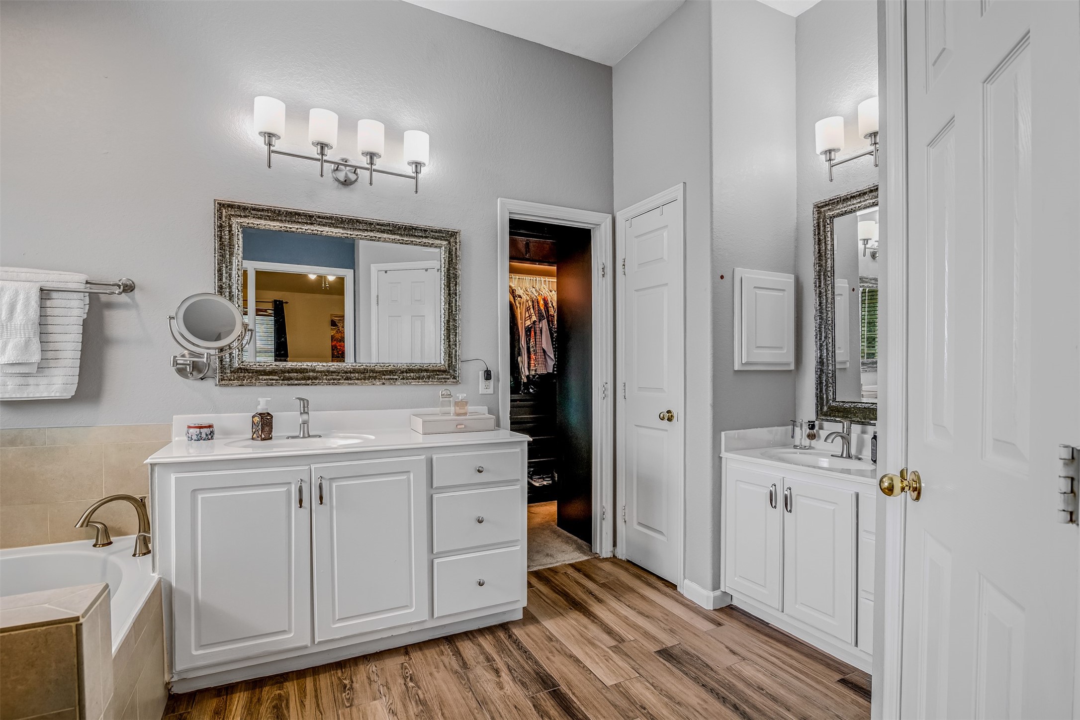 19303 Young Oak Street Spring, TX 77379 - Photo 16 of 29 The primary bathroom features double vanities with plenty of storage. Also features a professional closet system.