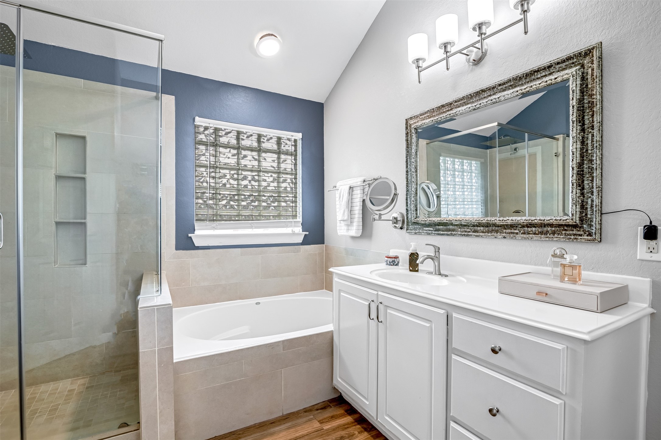19303 Young Oak Street Spring, TX 77379 - Photo 17 of 29 The primary bathroom also features a separate glass frame walk in shower with rain head as well as a separate Jetta oversized soaking tub.