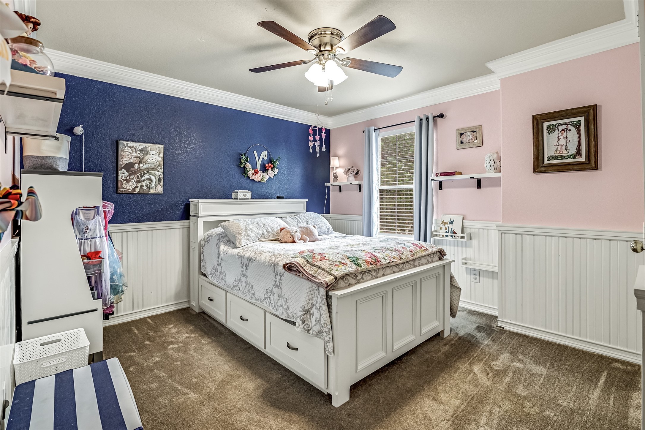 19303 Young Oak Street Spring, TX 77379 - Photo 18 of 29 Secondary bedroom with carpet, wainscotting. ceiling fan and picture window.