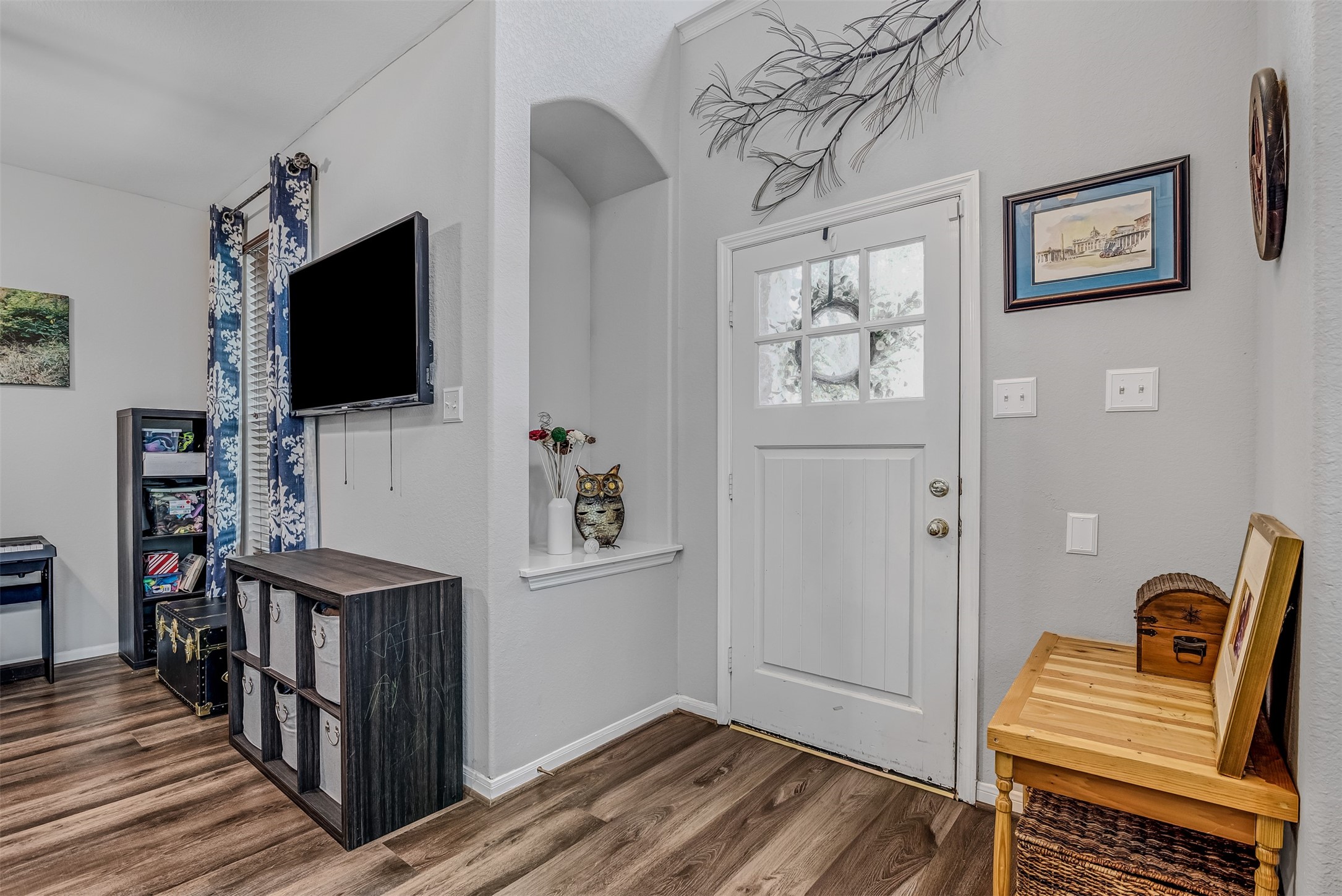 19303 Young Oak Street Spring, TX 77379 - Photo 2 of 29 Front entry of home features luxury vinyl plank flooring and arched niche.