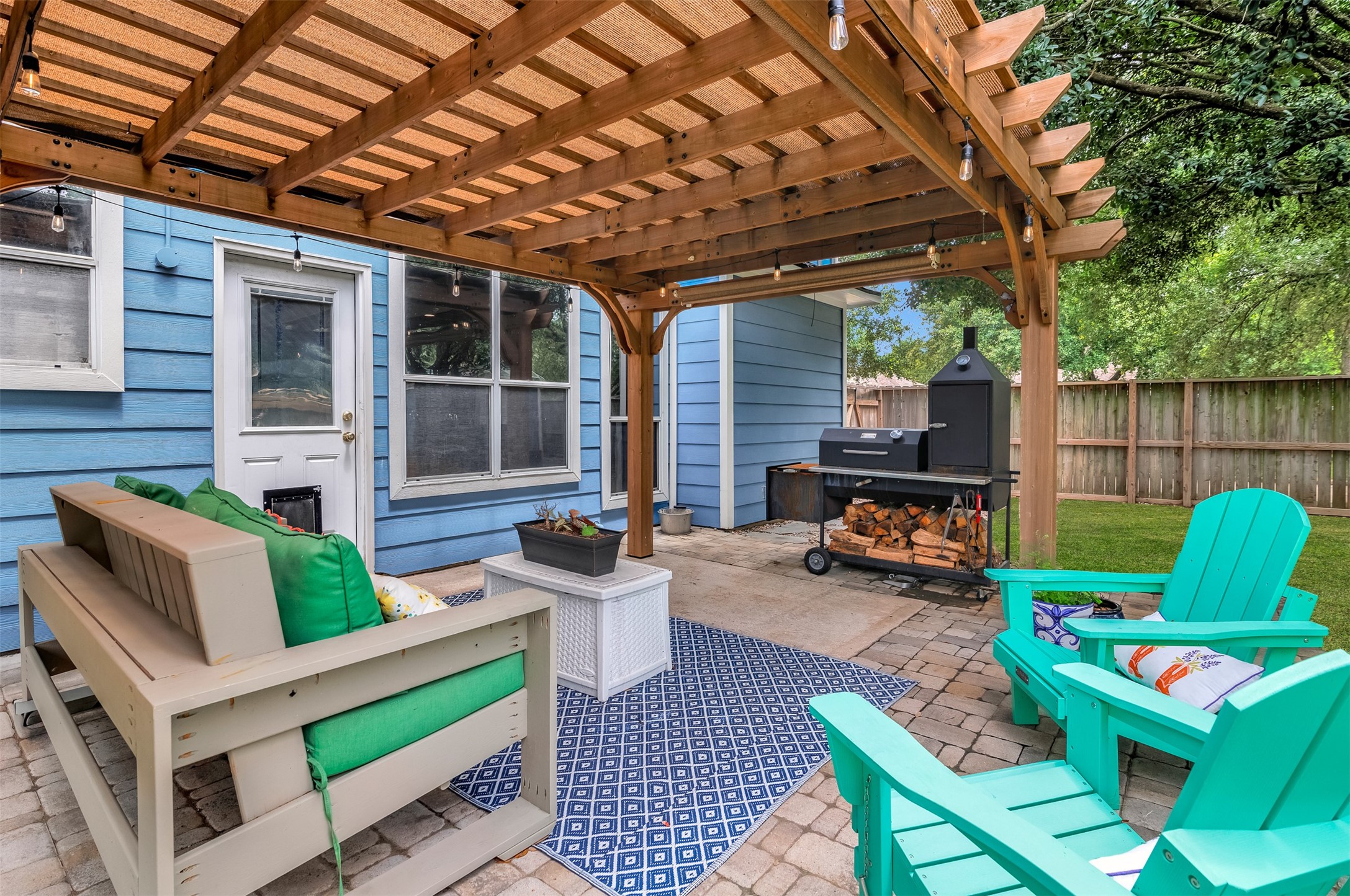 19303 Young Oak Street Spring, TX 77379 - Photo 26 of 29 The spacious backyard has plenty of room for the kids and pets to play and features a shed and large mature trees for plenty of shade. **Grass professionally enhanced**