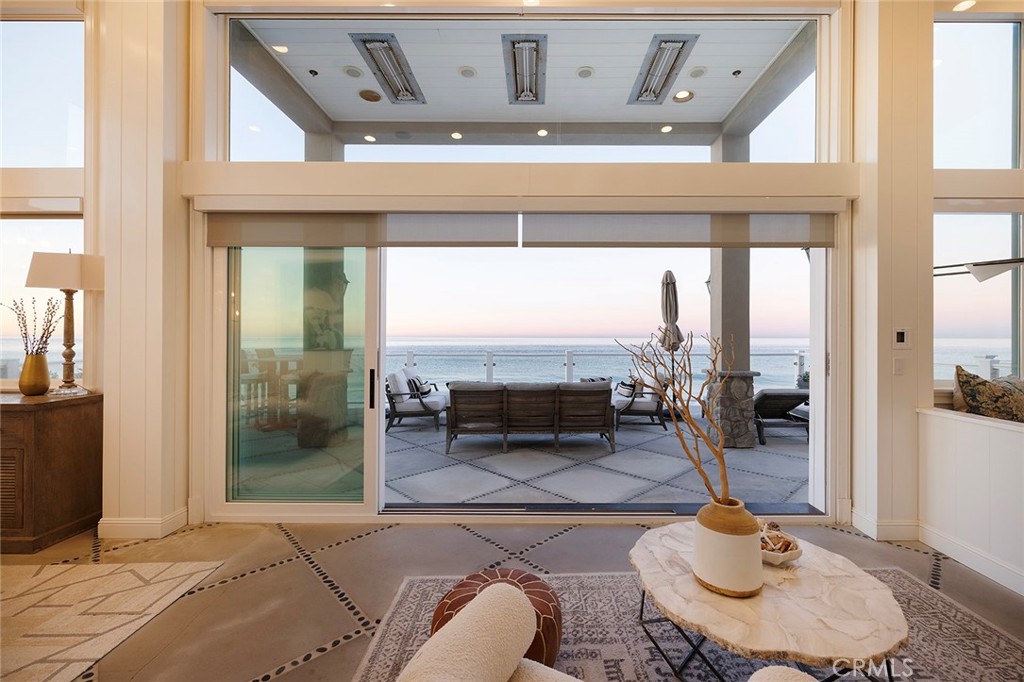35767 Beach Road Dana Point, CA 92624 - Photo 4 of 50 a living room with furniture and a floor to ceiling window