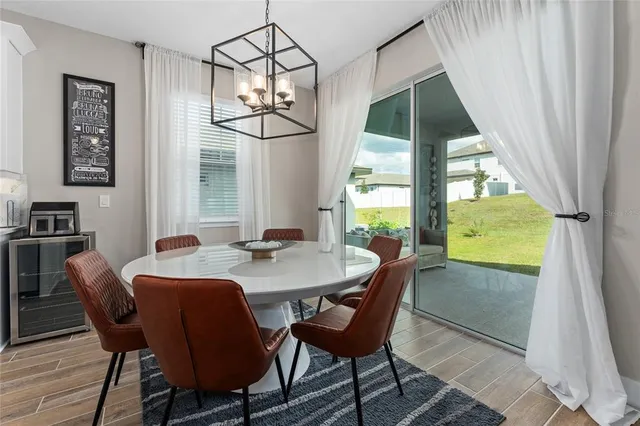a view of a dining room with furniture window and outside view