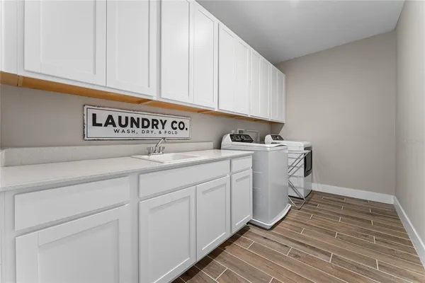 a utility room with cabinets