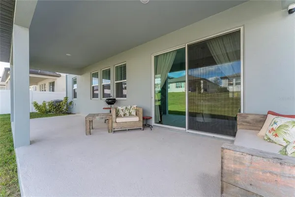 a living room with furniture and a gate