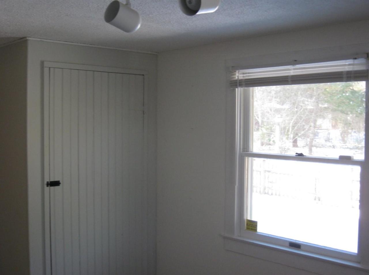 528 County Road Pocasset, MA 02559 - Photo 17 of 29 a view of an empty room with a window