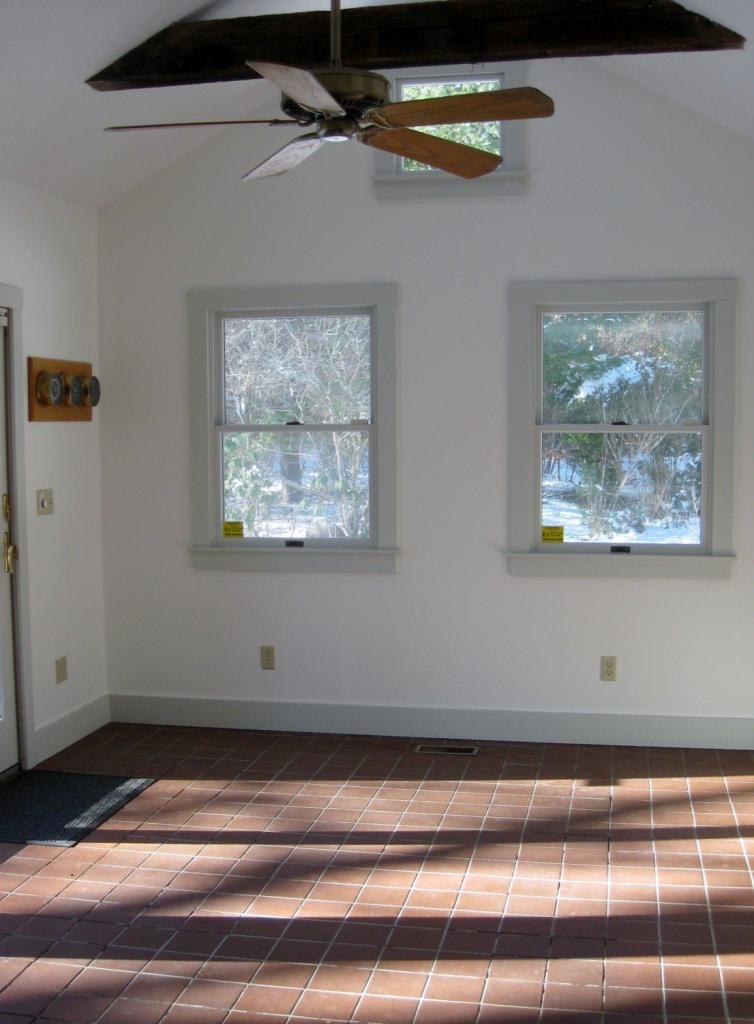 528 County Road Pocasset, MA 02559 - Photo 7 of 29 a view of a hallway with paintings on the wall