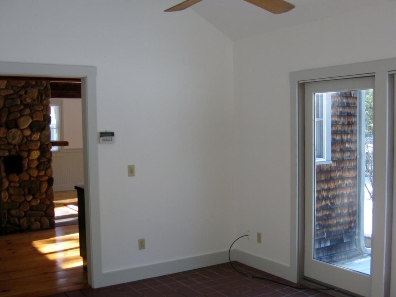528 County Road Pocasset, MA 02559 - Photo 9 of 29 a view of empty room with wooden floor and fan
