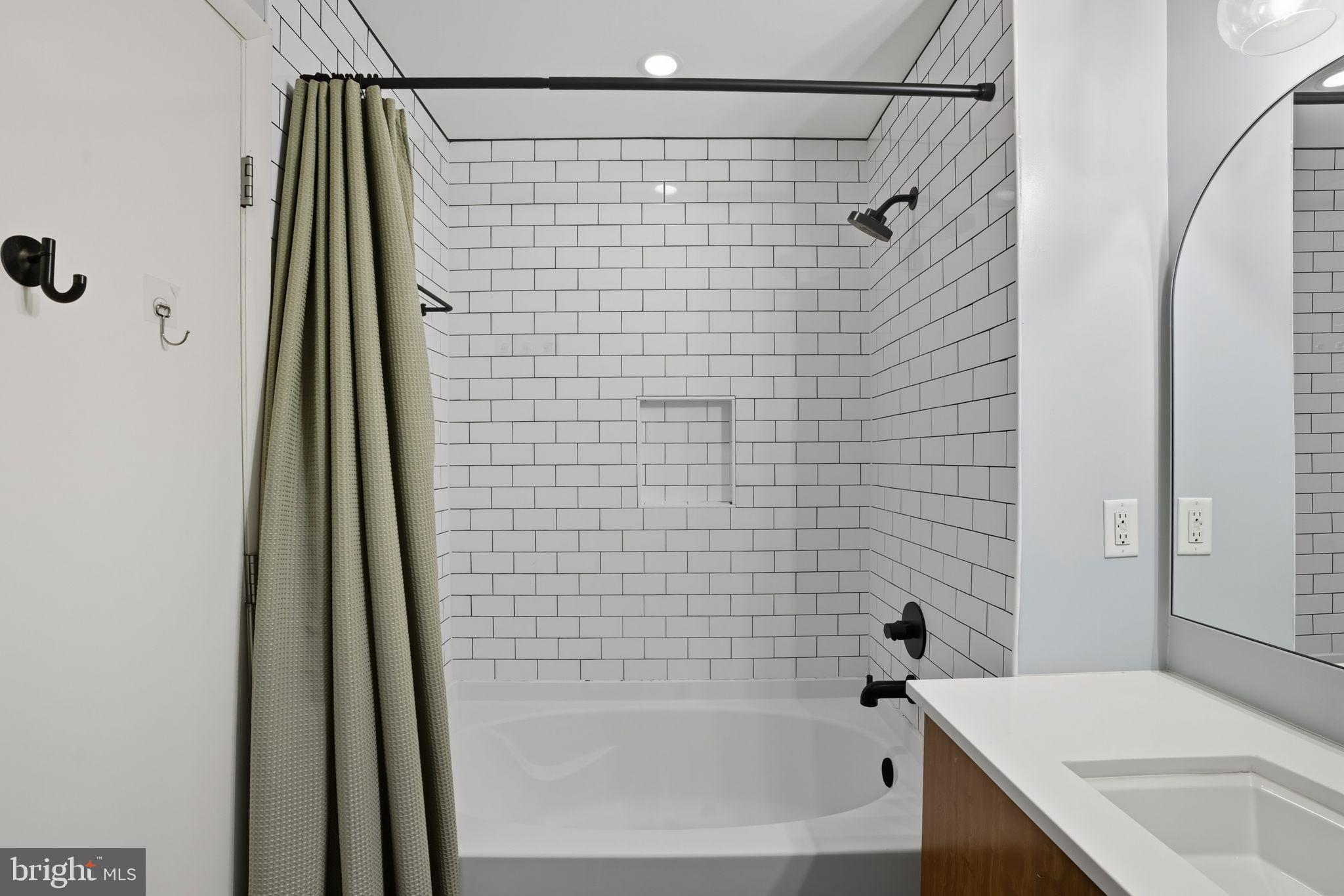 437 New York Avenue Northwest, Unit 222 Washington, DC 20001 - Photo 11 of 20 a bathroom with a shower and a sink