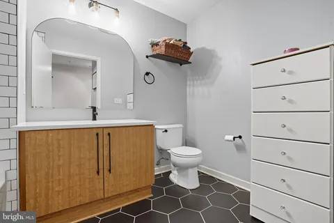 a bathroom with a shower and a sink