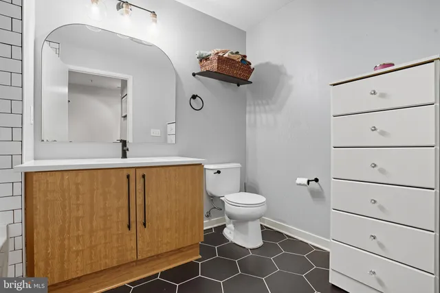 a bathroom with a shower and a sink