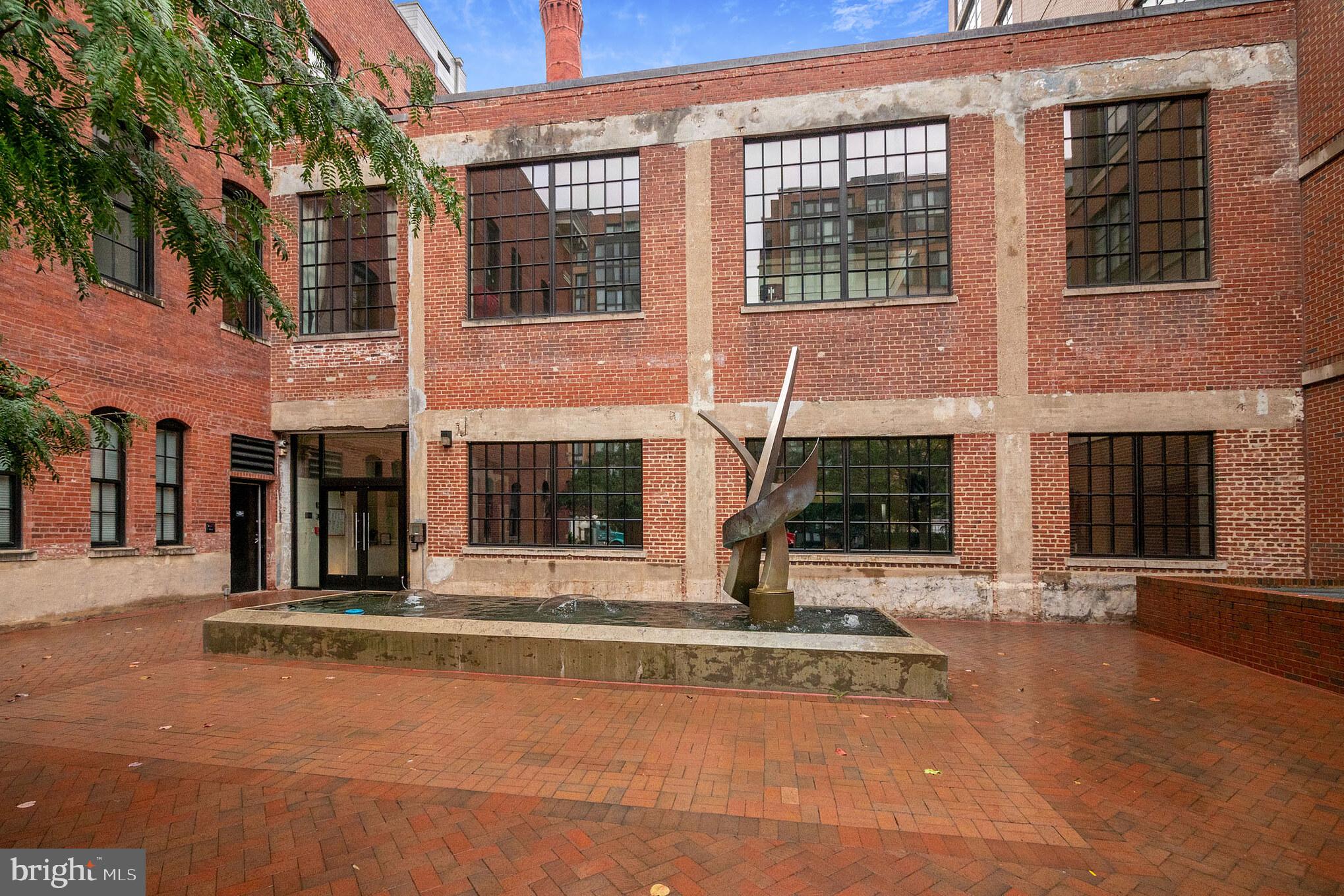 437 New York Avenue Northwest, Unit 222 Washington, DC 20001 - Photo 16 of 20 a view of a building with a outdoor space