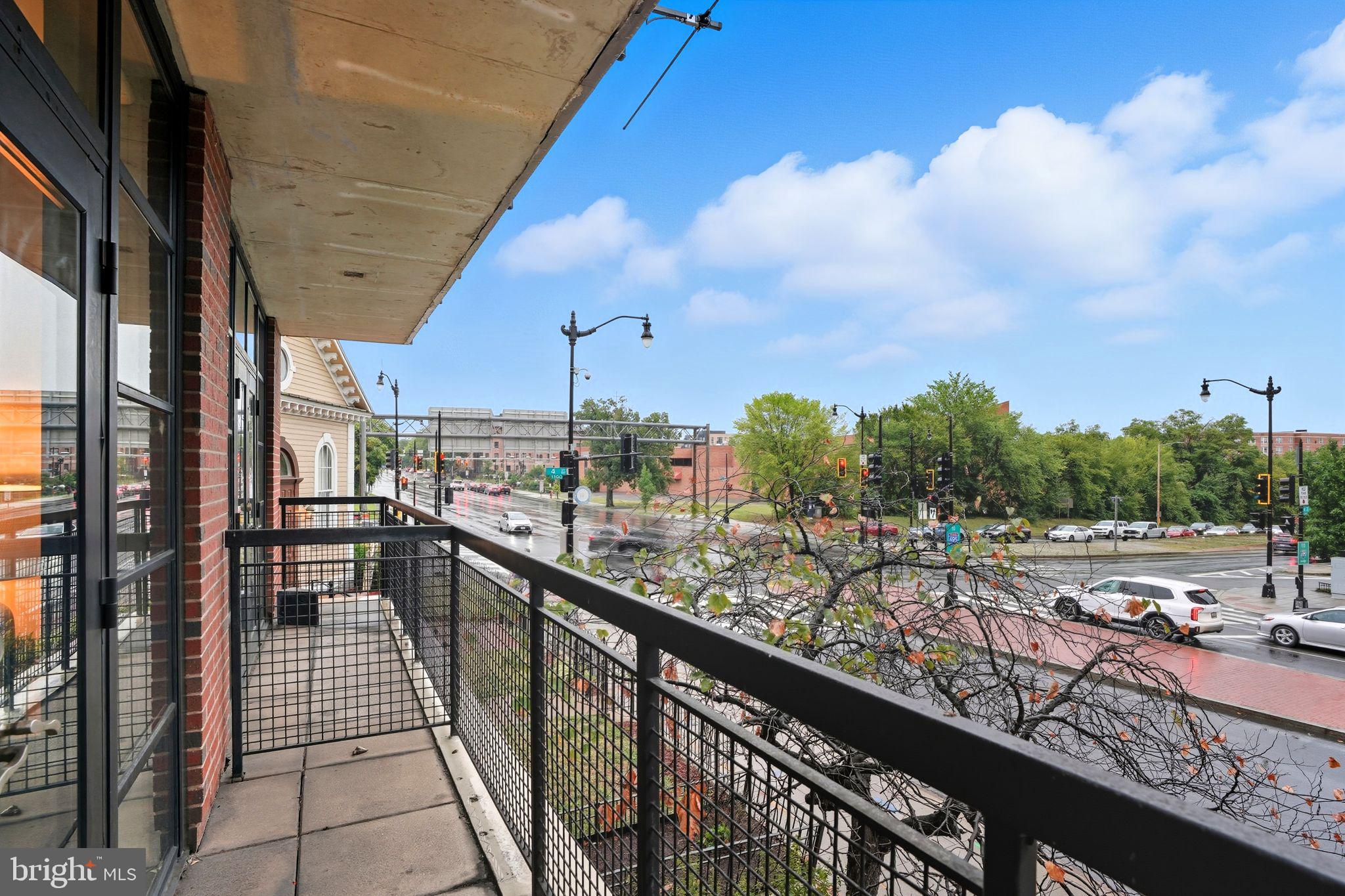 437 New York Avenue Northwest, Unit 222 Washington, DC 20001 - Photo 6 of 20 a view of a city from a balcony