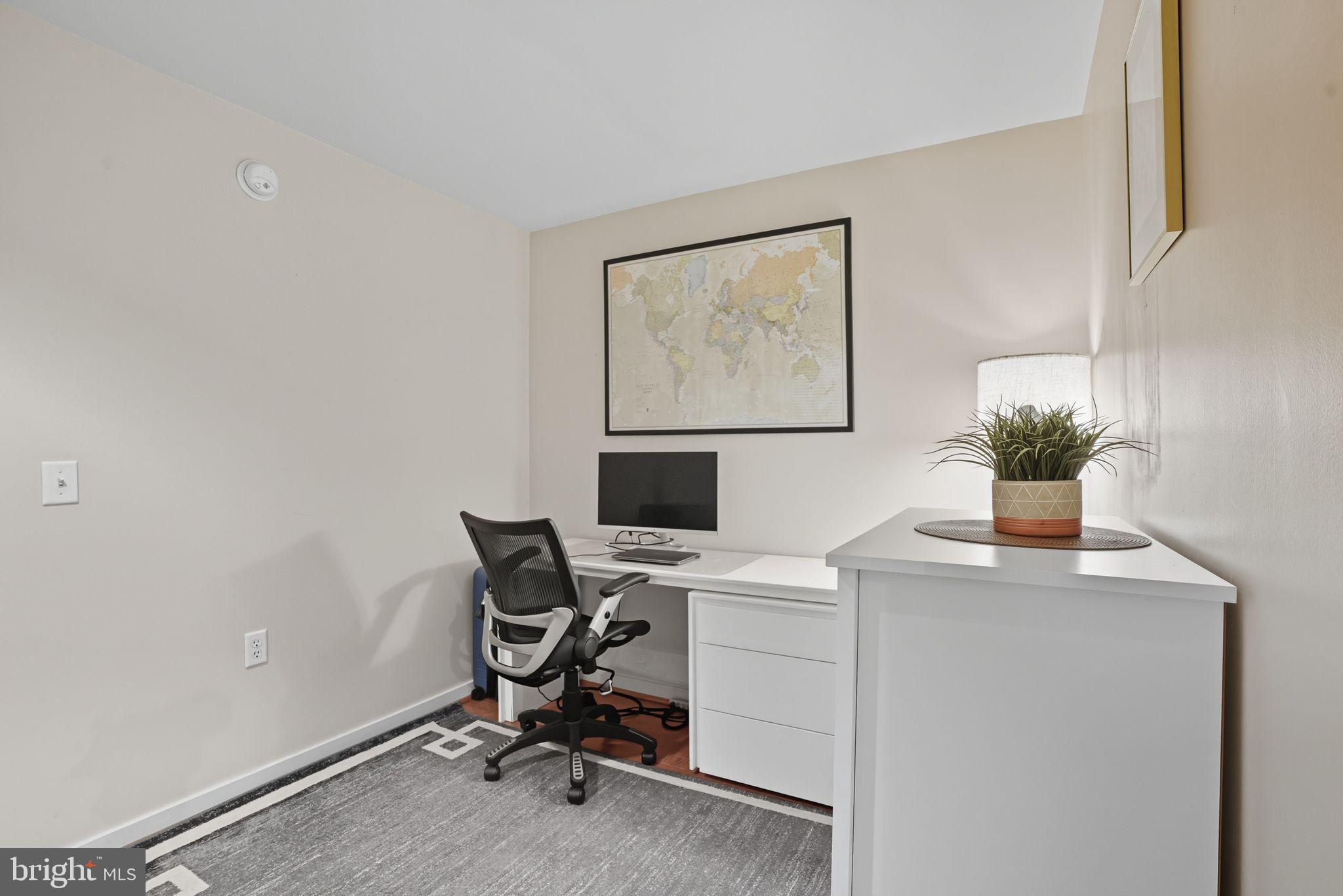437 New York Avenue Northwest, Unit 222 Washington, DC 20001 - Photo 8 of 20 a view of a workspace with furniture and a window