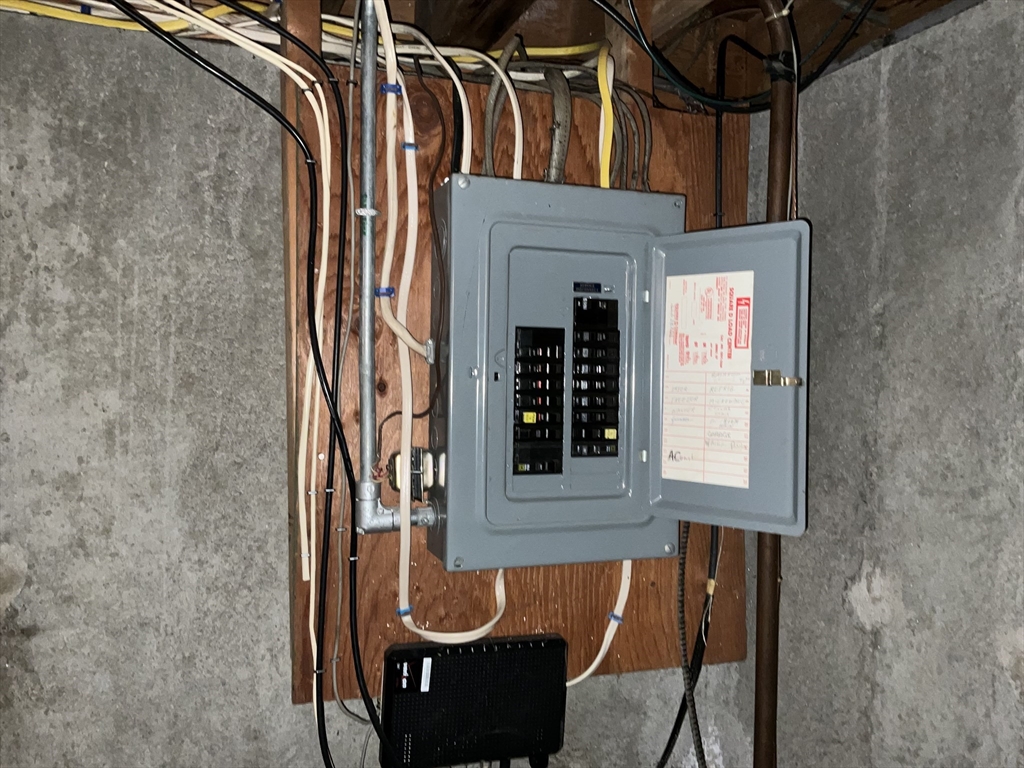 93 Plain Street Mansfield, MA 02048 - Photo 17 of 20 a view of a door with a chair and bench