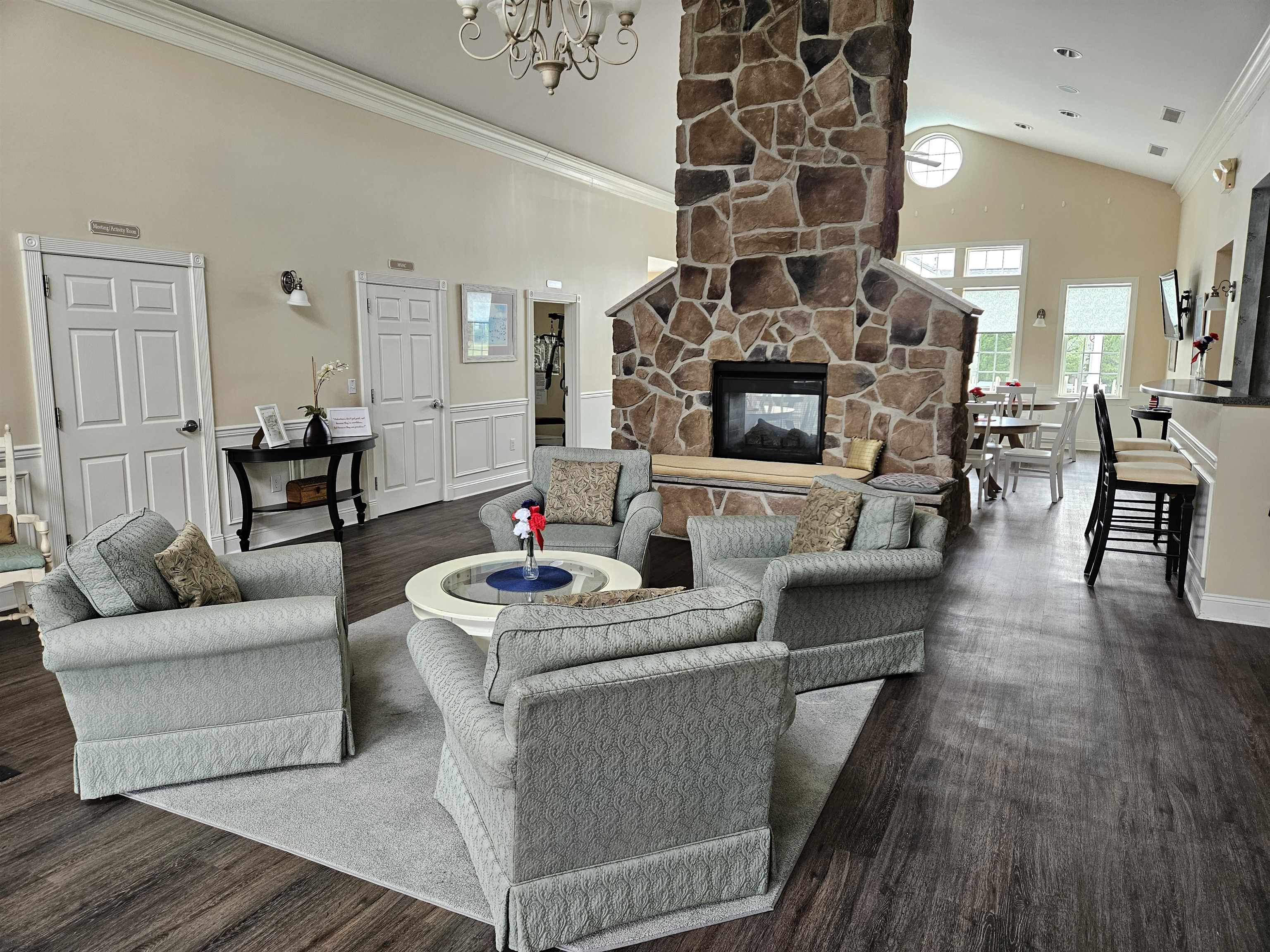 321 Aberdeen Way Rio Grande, NJ 08242 - Photo 29 of 32 a living room with fireplace furniture and a wooden floor