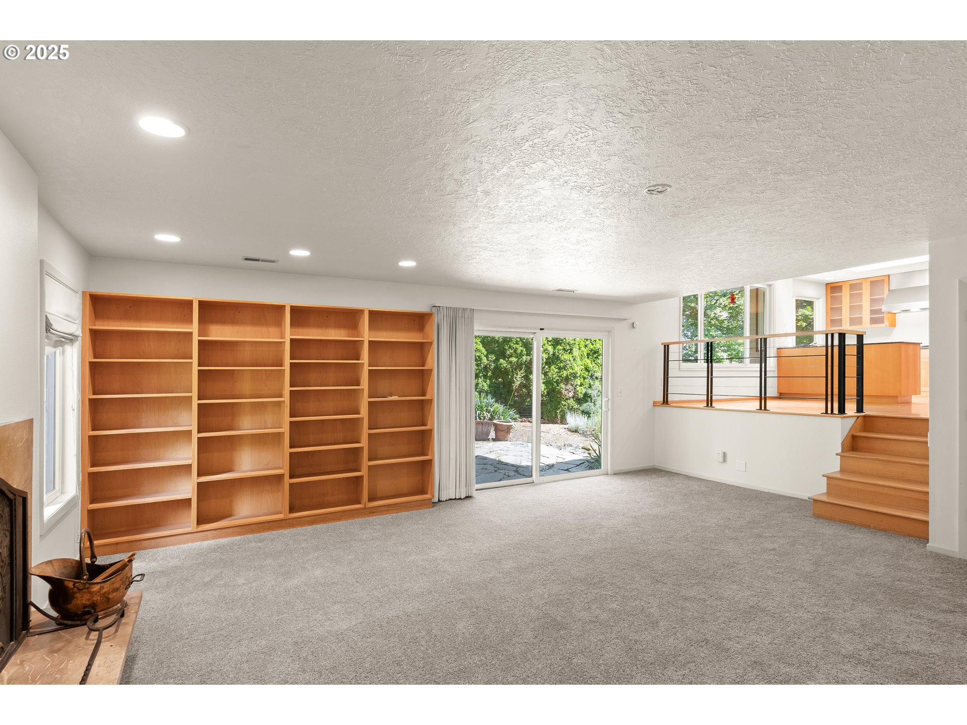 680 Northwest Torryview Lane Portland, OR 97229 - Photo 11 of 18 a view of an empty room with a window and balcony