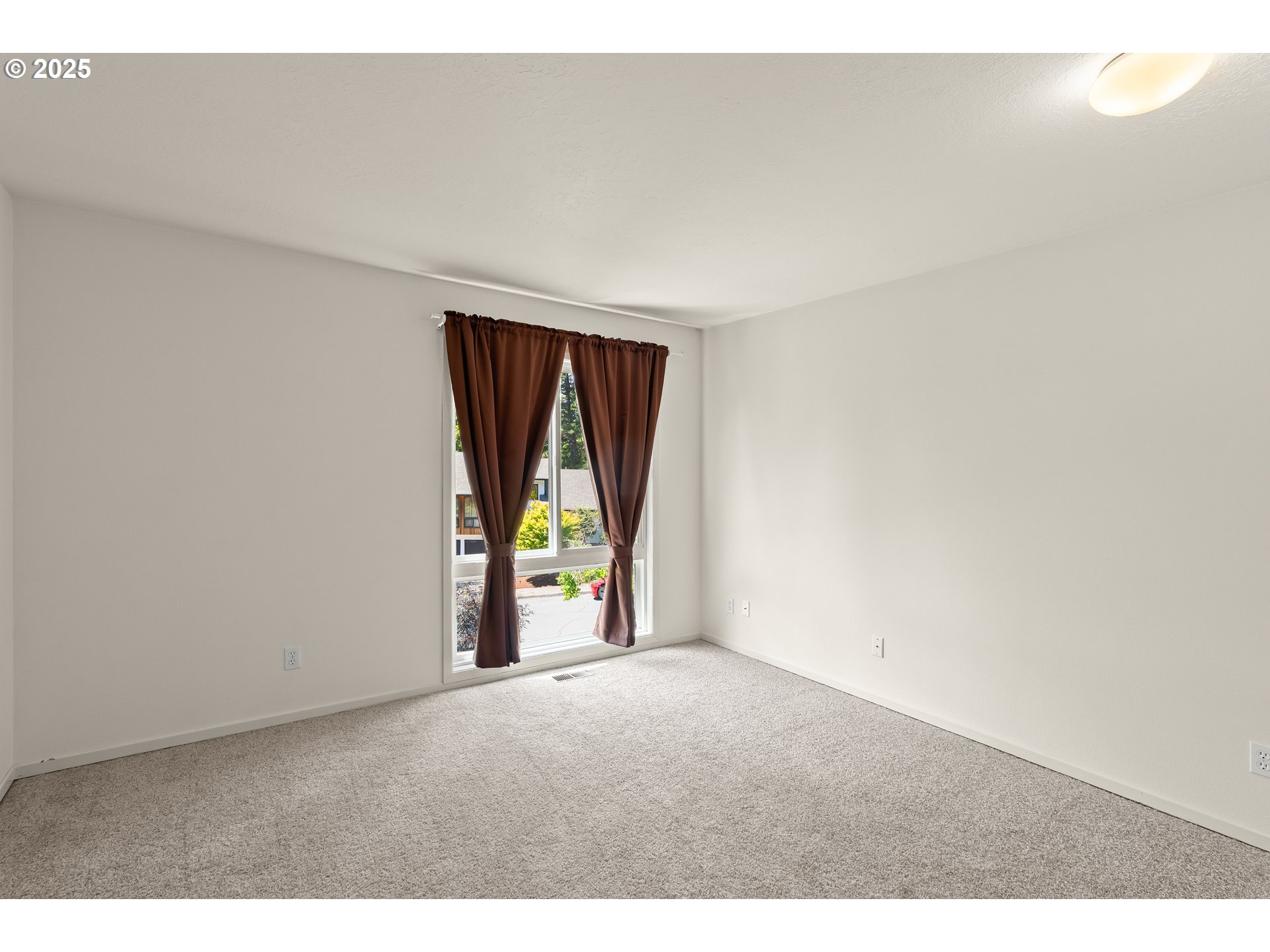 680 Northwest Torryview Lane Portland, OR 97229 - Photo 12 of 18 a view of an empty room and window