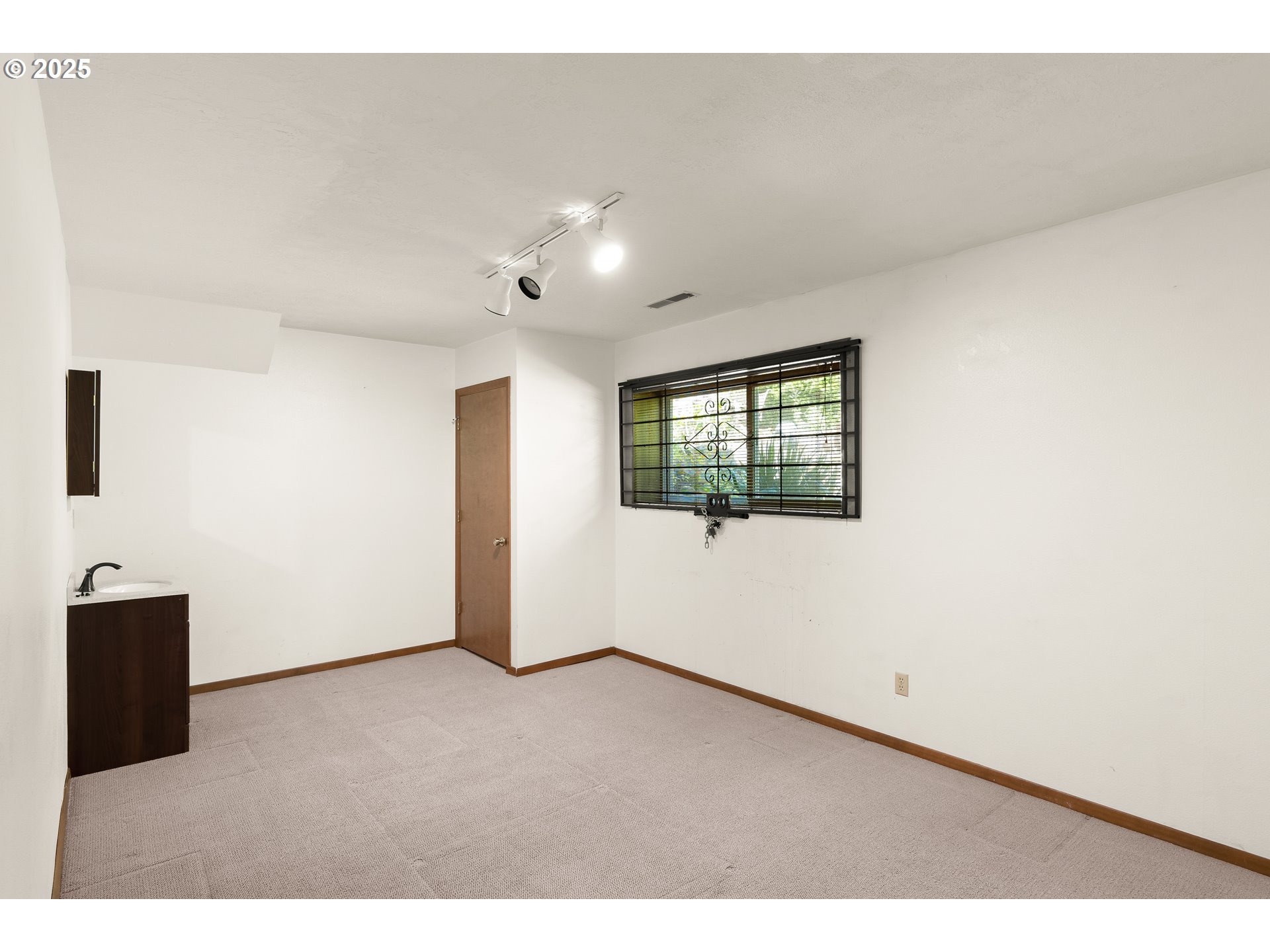 680 Northwest Torryview Lane Portland, OR 97229 - Photo 16 of 18 a view of an empty room with a window