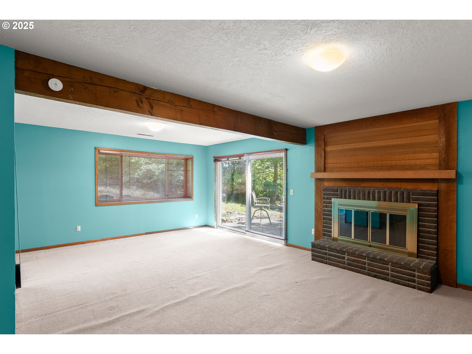 680 Northwest Torryview Lane Portland, OR 97229 - Photo 17 of 18 a bedroom with furniture and a fireplace