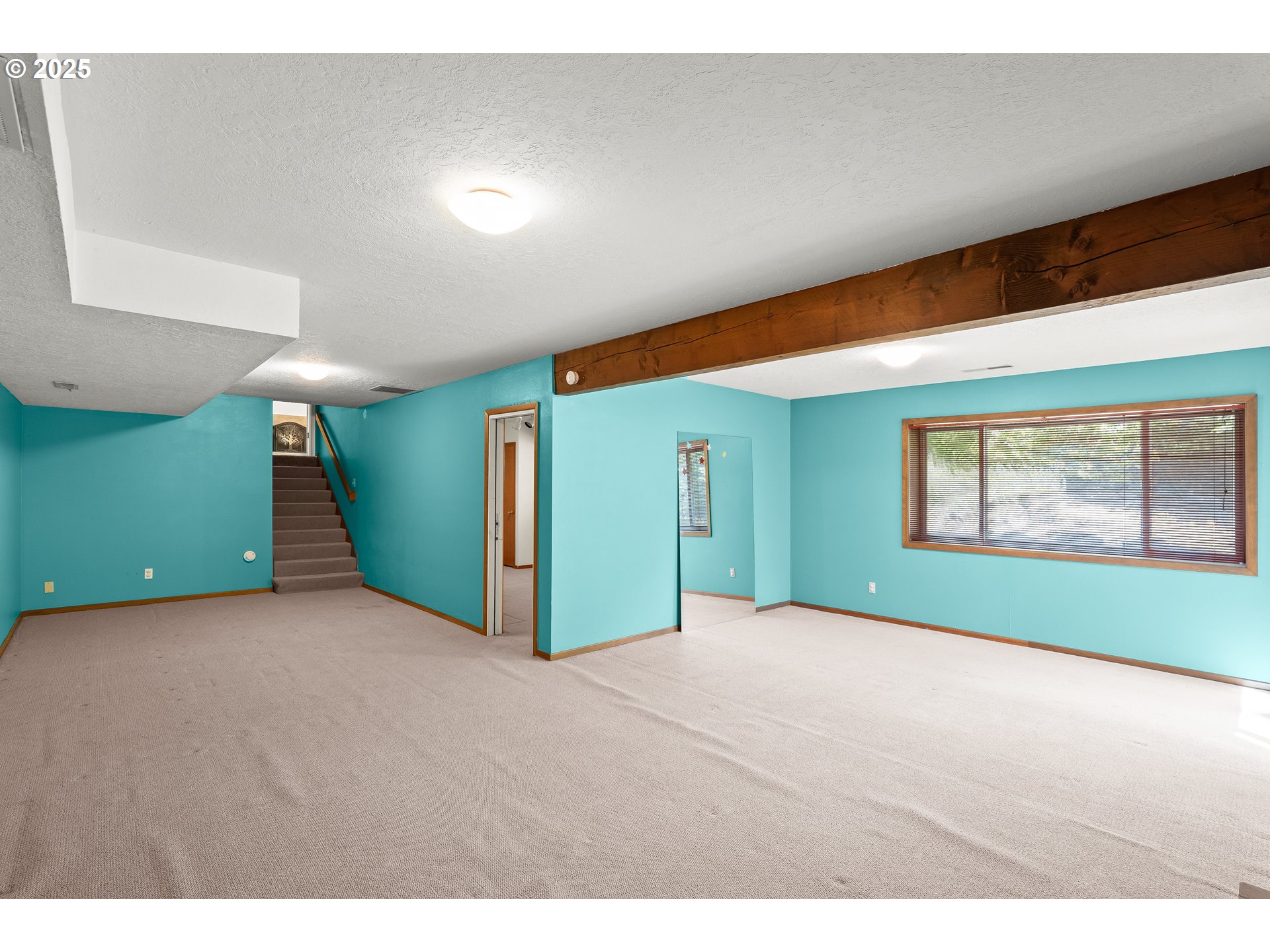 680 Northwest Torryview Lane Portland, OR 97229 - Photo 18 of 18 a view of an empty room with window and cabinet