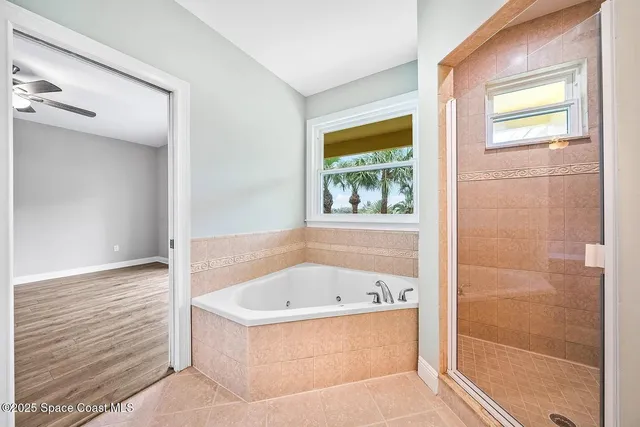 a white bath tub sitting next to a window