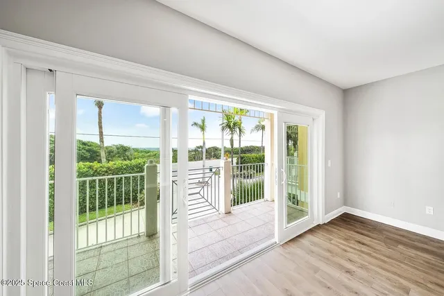 a view of front door and wooden floor