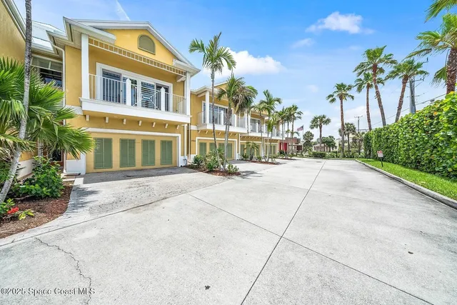 a view of a building with potted plants