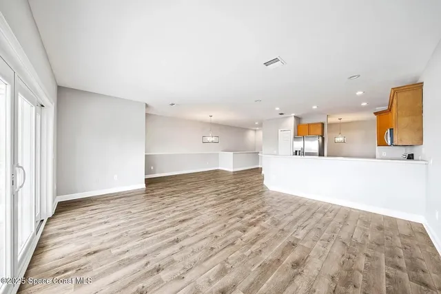 a view of a kitchen and a window