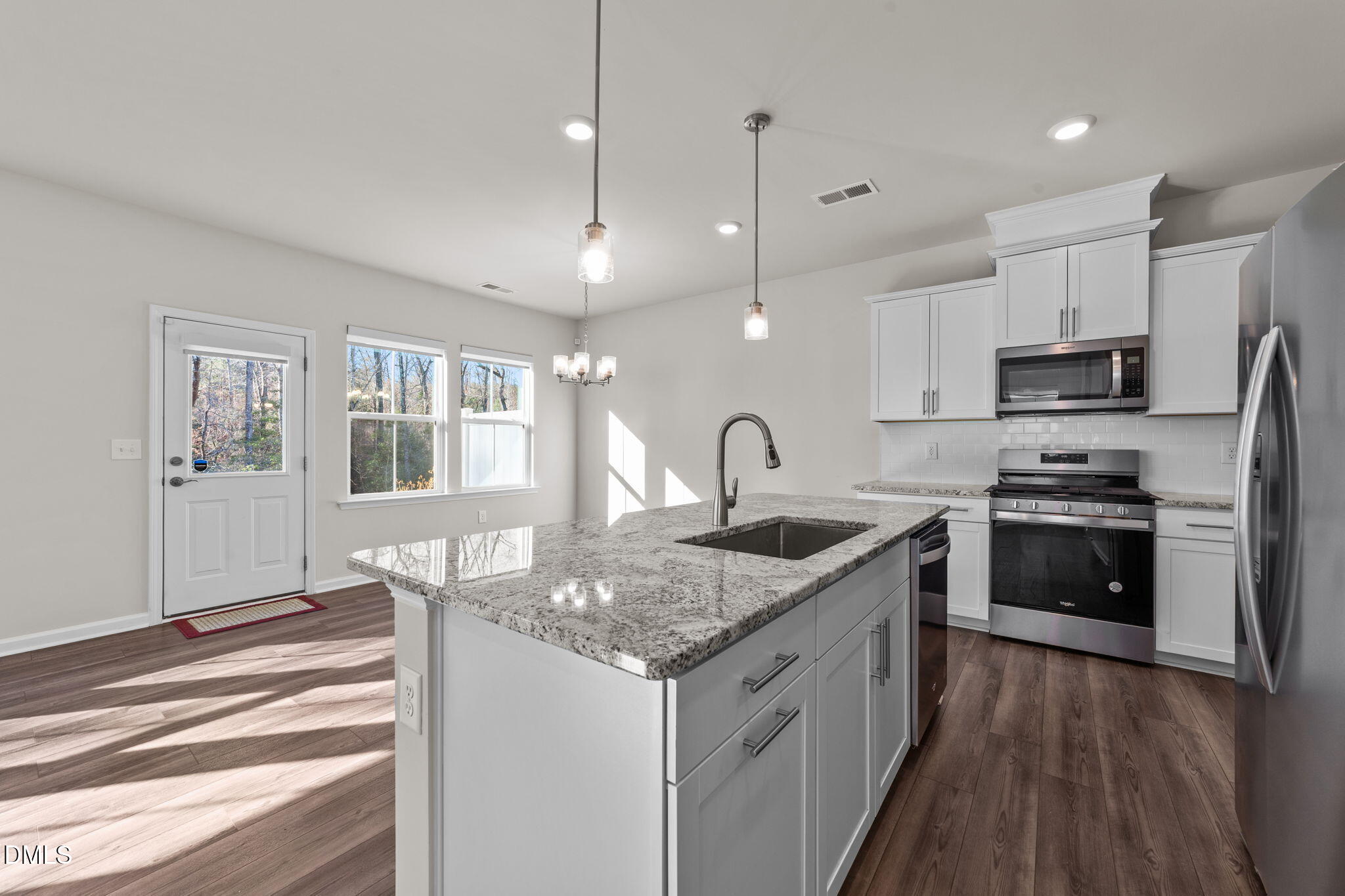 427 Glen Clova Drive Raleigh, NC 27603 - Photo 11 of 42 a kitchen with a stove a sink and a refrigerator