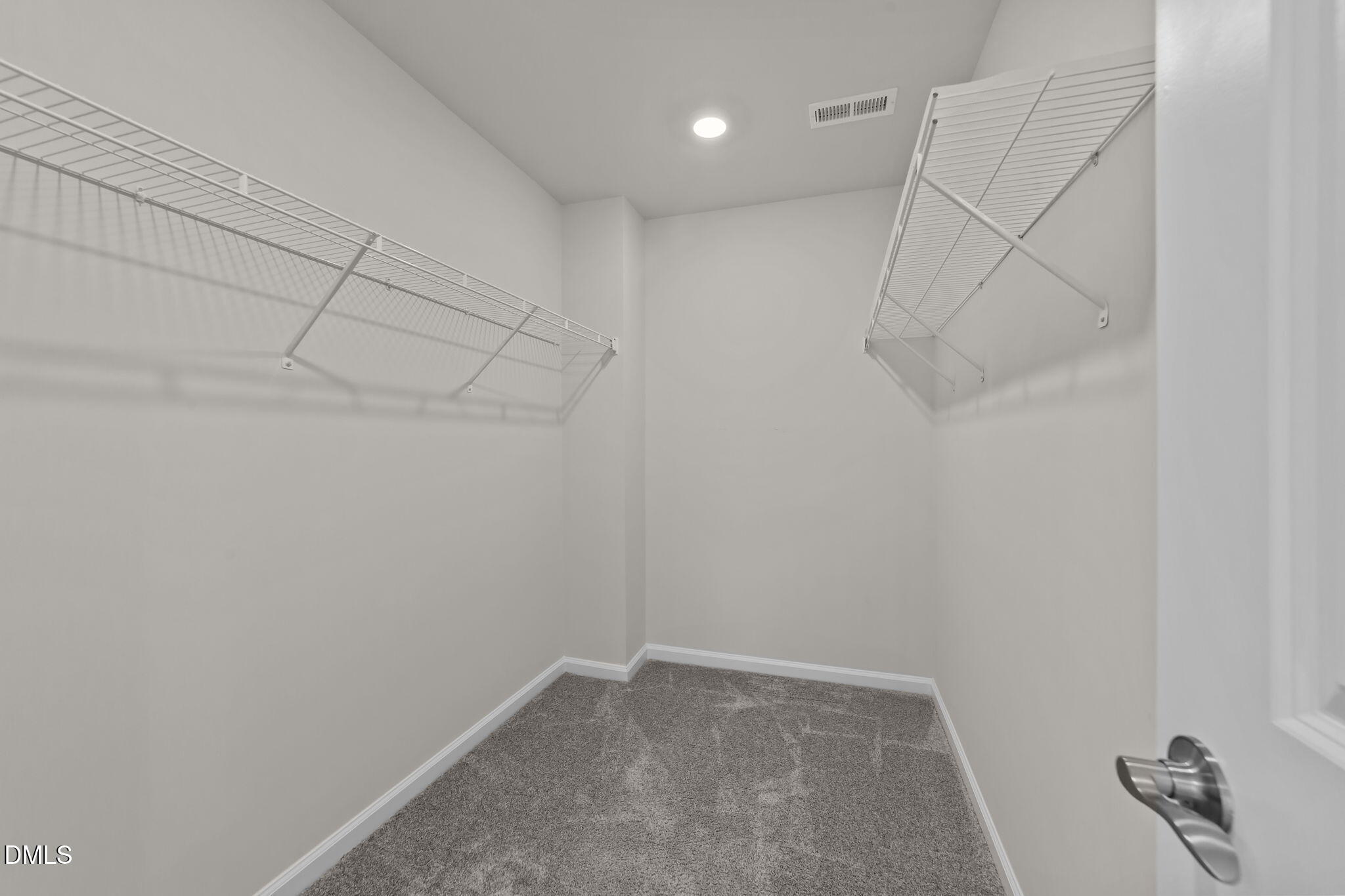 427 Glen Clova Drive Raleigh, NC 27603 - Photo 19 of 42 a view of a room with racks on the wall