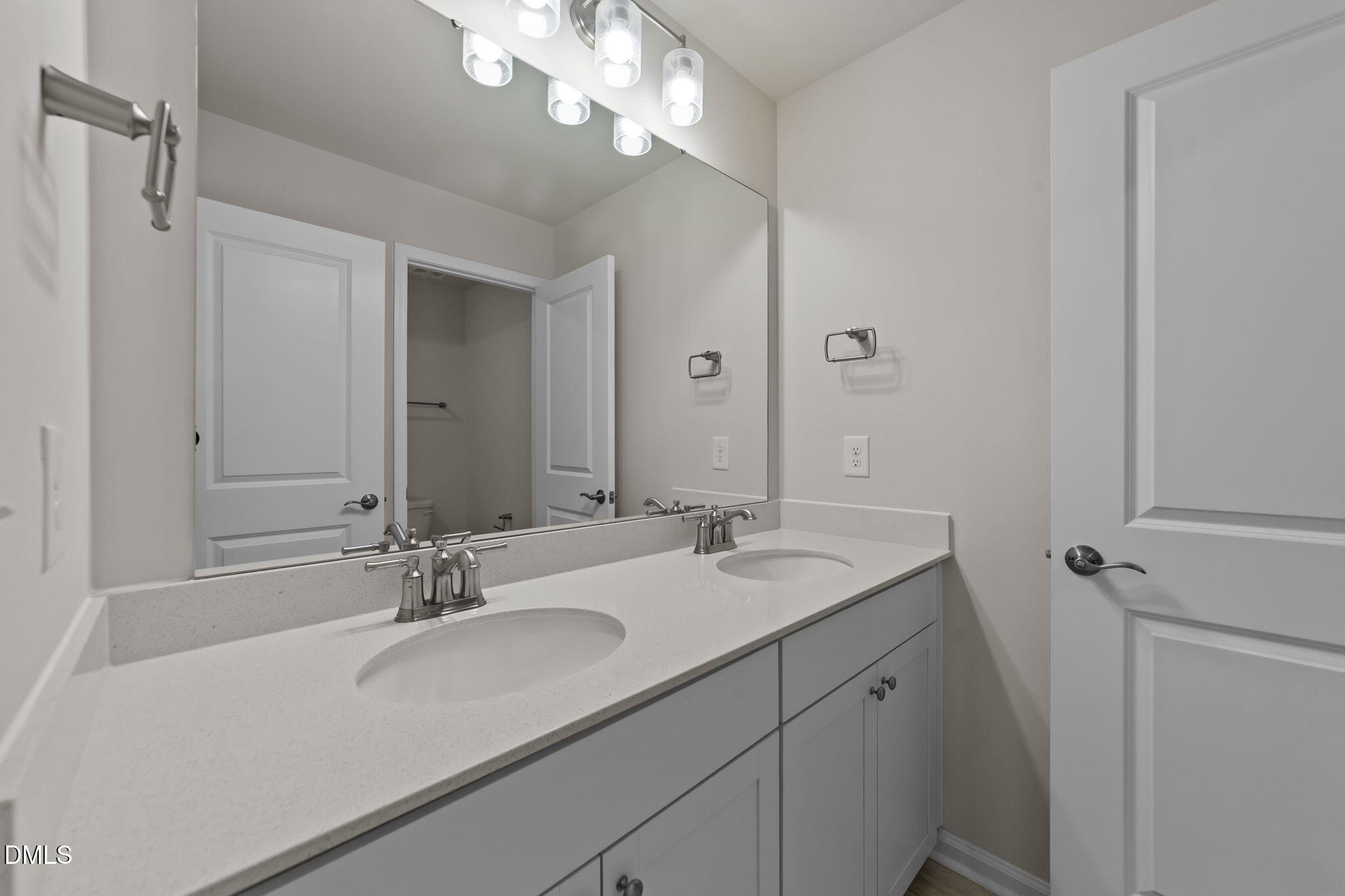 427 Glen Clova Drive Raleigh, NC 27603 - Photo 23 of 42 a bathroom with a sink double vanity and a mirror