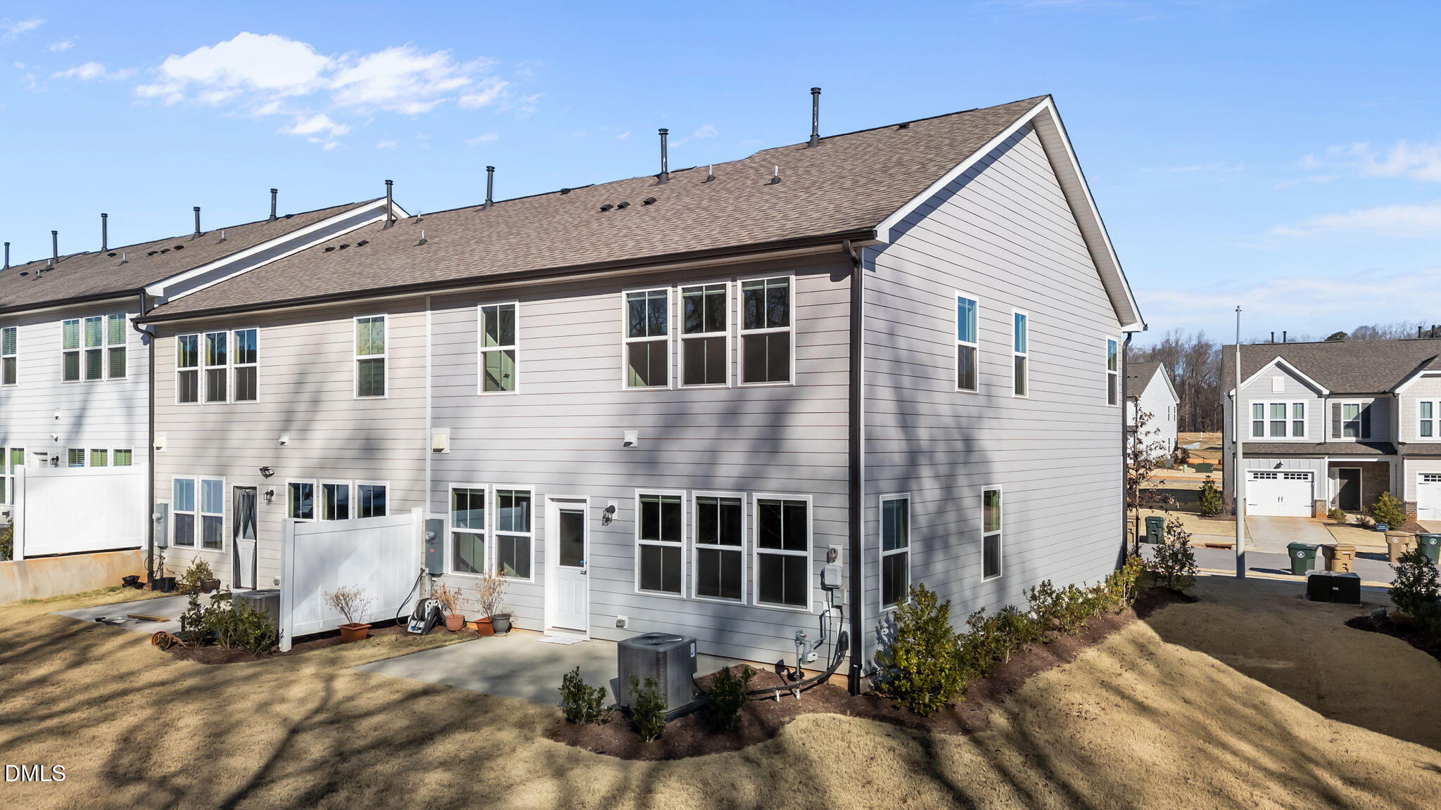 427 Glen Clova Drive Raleigh, NC 27603 - Photo 29 of 42 a view of a white building among the street with palm trees
