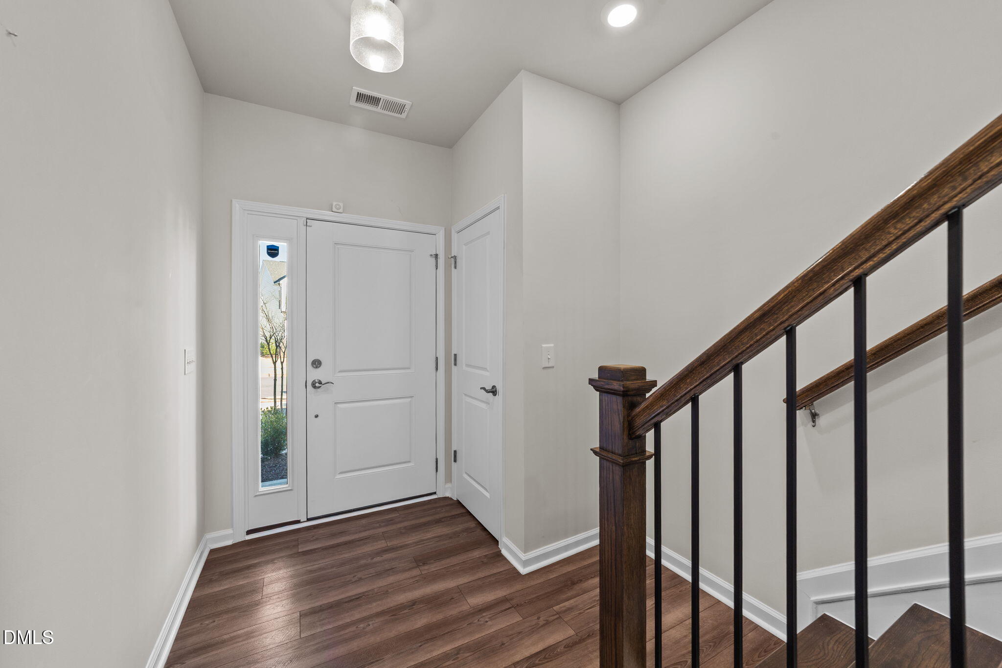 427 Glen Clova Drive Raleigh, NC 27603 - Photo 3 of 42 a view of an entryway with wooden floor