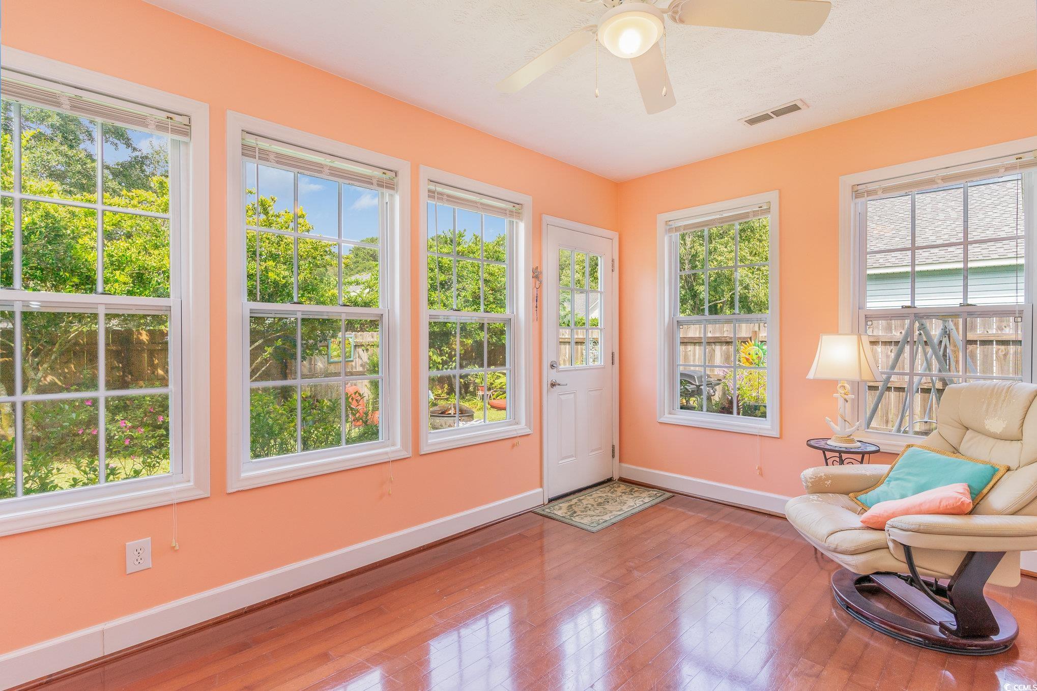 7966 Spruce Lane Murrells Inlet, SC 29576 - Photo 14 of 31 Living room with ceiling fan, hardwood / wood-styl