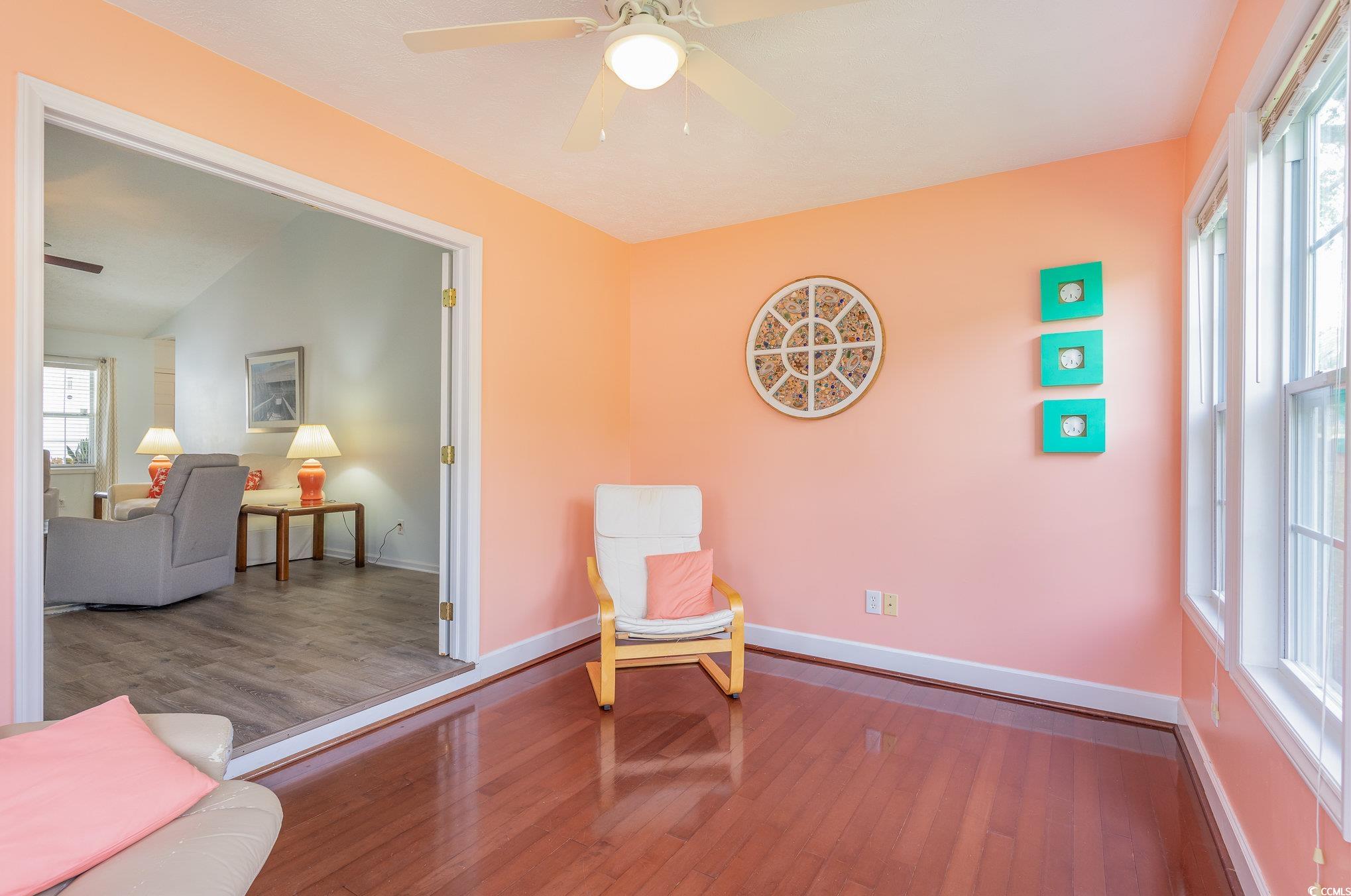 7966 Spruce Lane Murrells Inlet, SC 29576 - Photo 17 of 31 Living area with ceiling fan and hardwood / wood-s