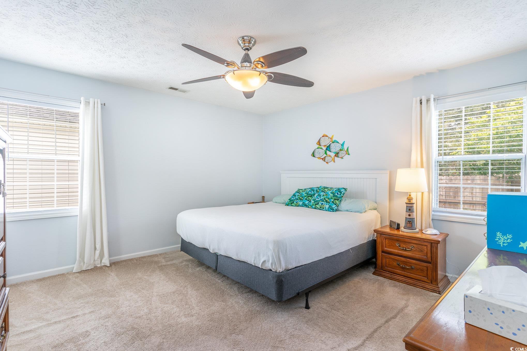7966 Spruce Lane Murrells Inlet, SC 29576 - Photo 18 of 31 Unfurnished room with ceiling fan and hardwood / w