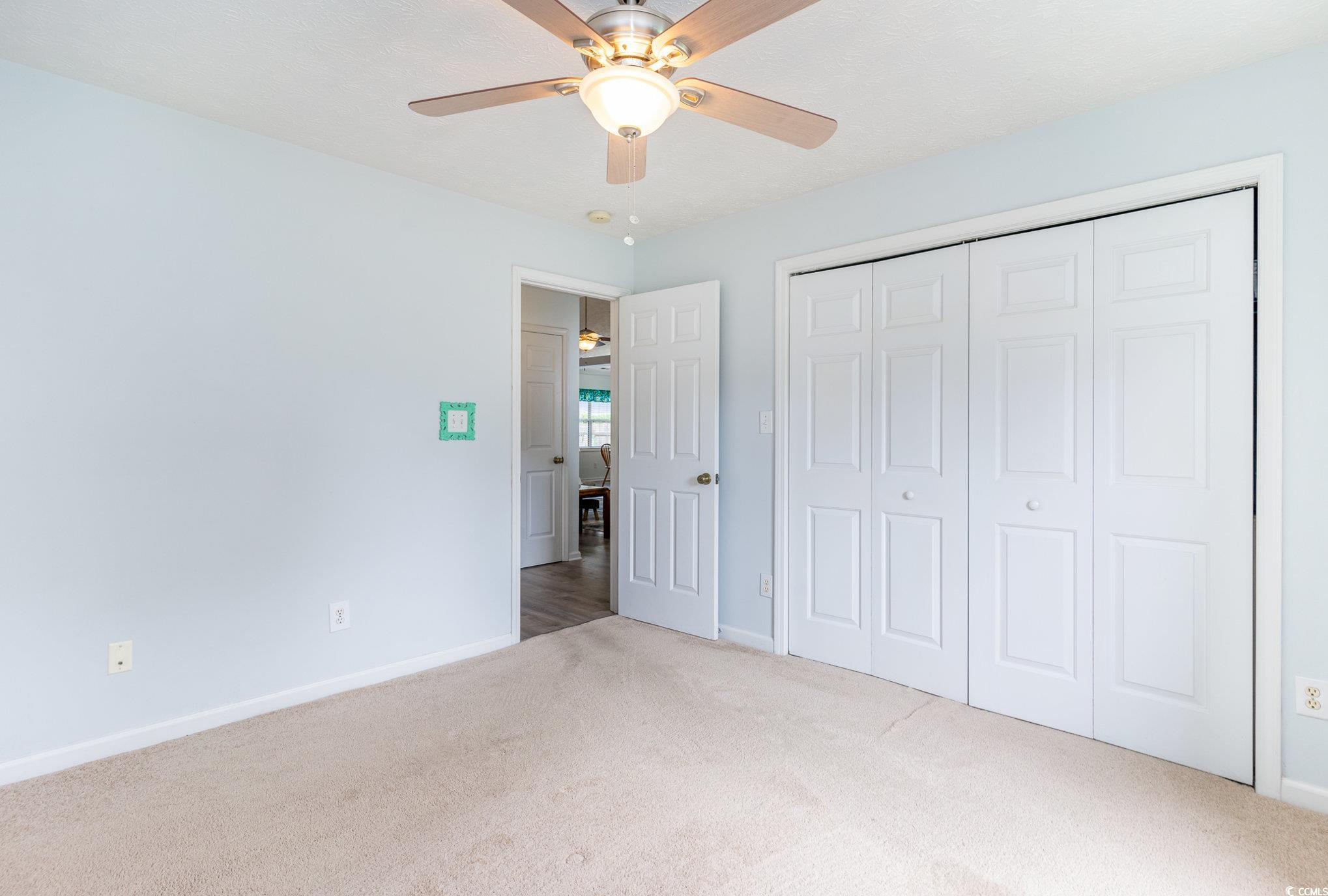 7966 Spruce Lane Murrells Inlet, SC 29576 - Photo 25 of 31 Bathroom featuring a textured ceiling, vanity, toi