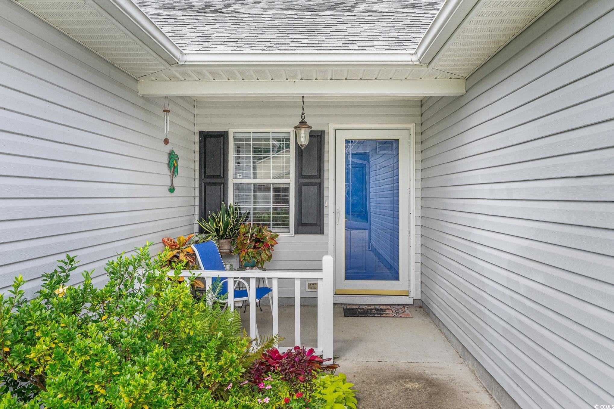 7966 Spruce Lane Murrells Inlet, SC 29576 - Photo 3 of 31 Doorway to property featuring a porch