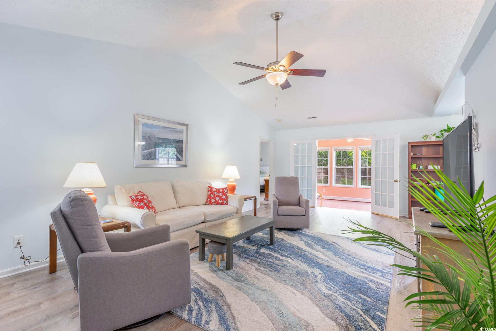7966 Spruce Lane Murrells Inlet, SC 29576 - Photo 4 of 31 Living room featuring high vaulted ceiling, light