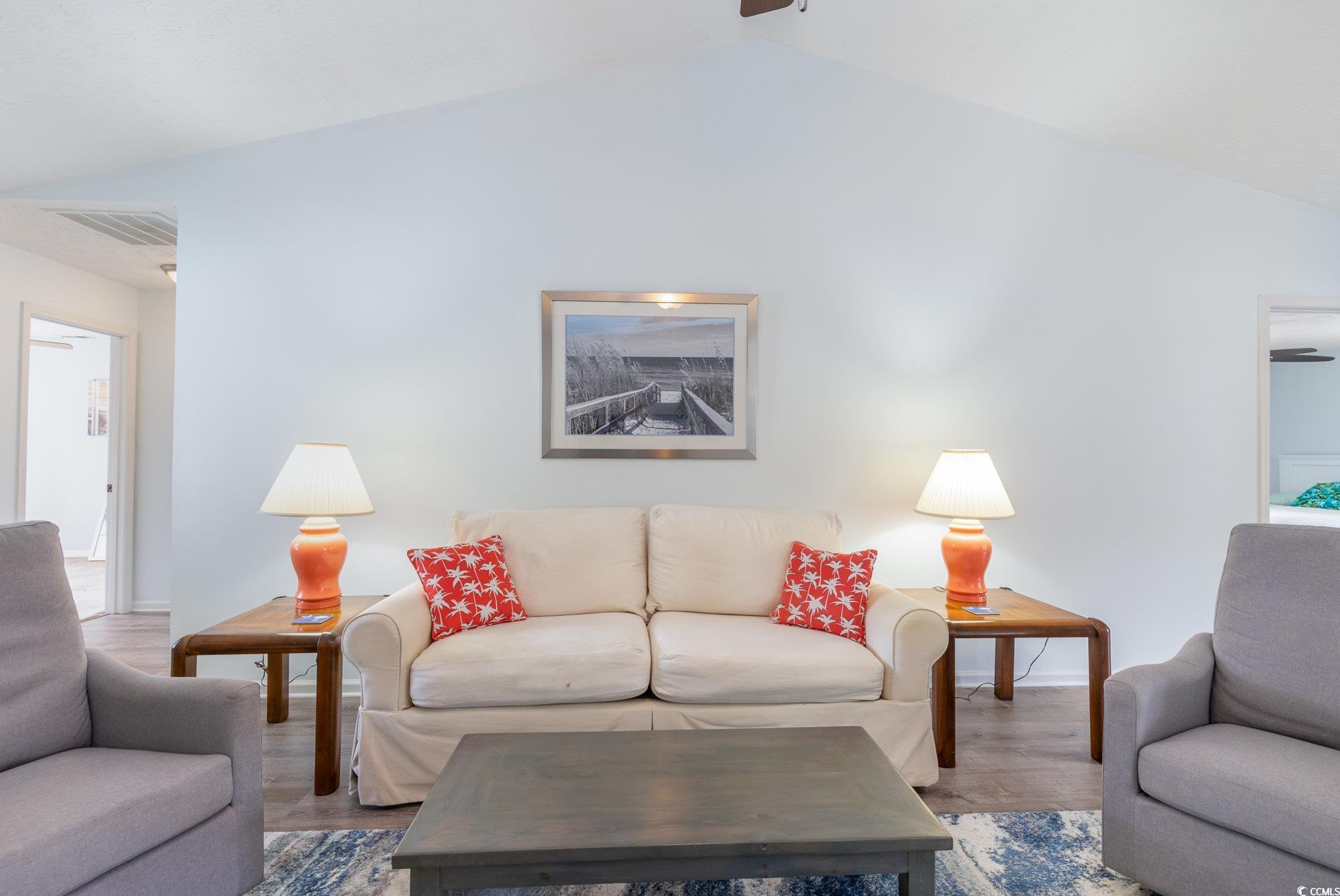 7966 Spruce Lane Murrells Inlet, SC 29576 - Photo 7 of 31 Living room with vaulted ceiling, hardwood / wood-
