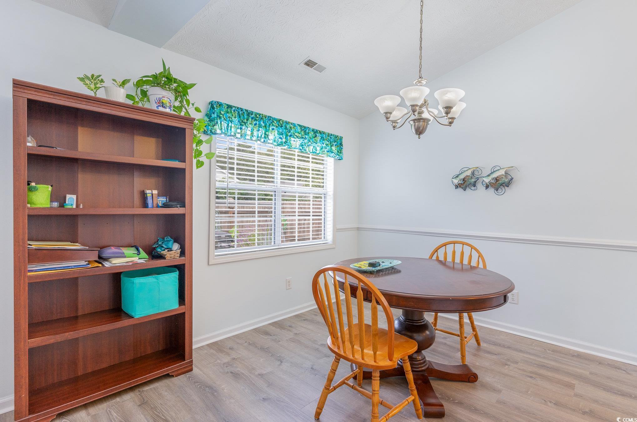 7966 Spruce Lane Murrells Inlet, SC 29576 - Photo 8 of 31 Living room featuring hardwood / wood-style floori